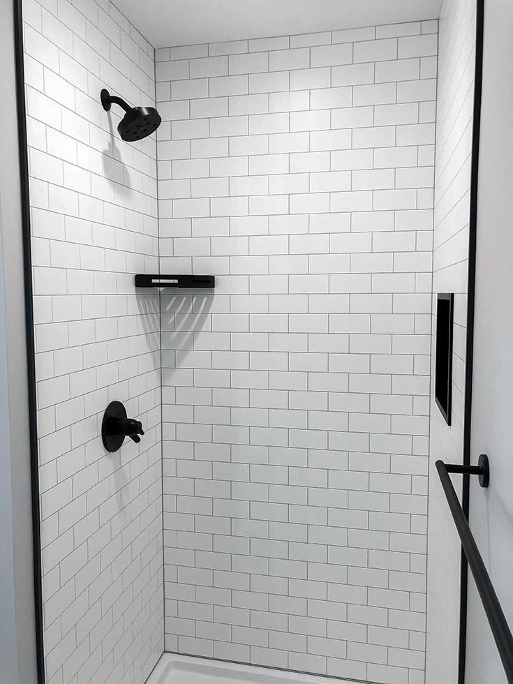 Classic subway-tile Aqua-lock shower remodel