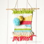 woven-textile-wall-hanging-poms.2.jpg