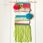 woven-textile-wall-hanging-poms.jpg